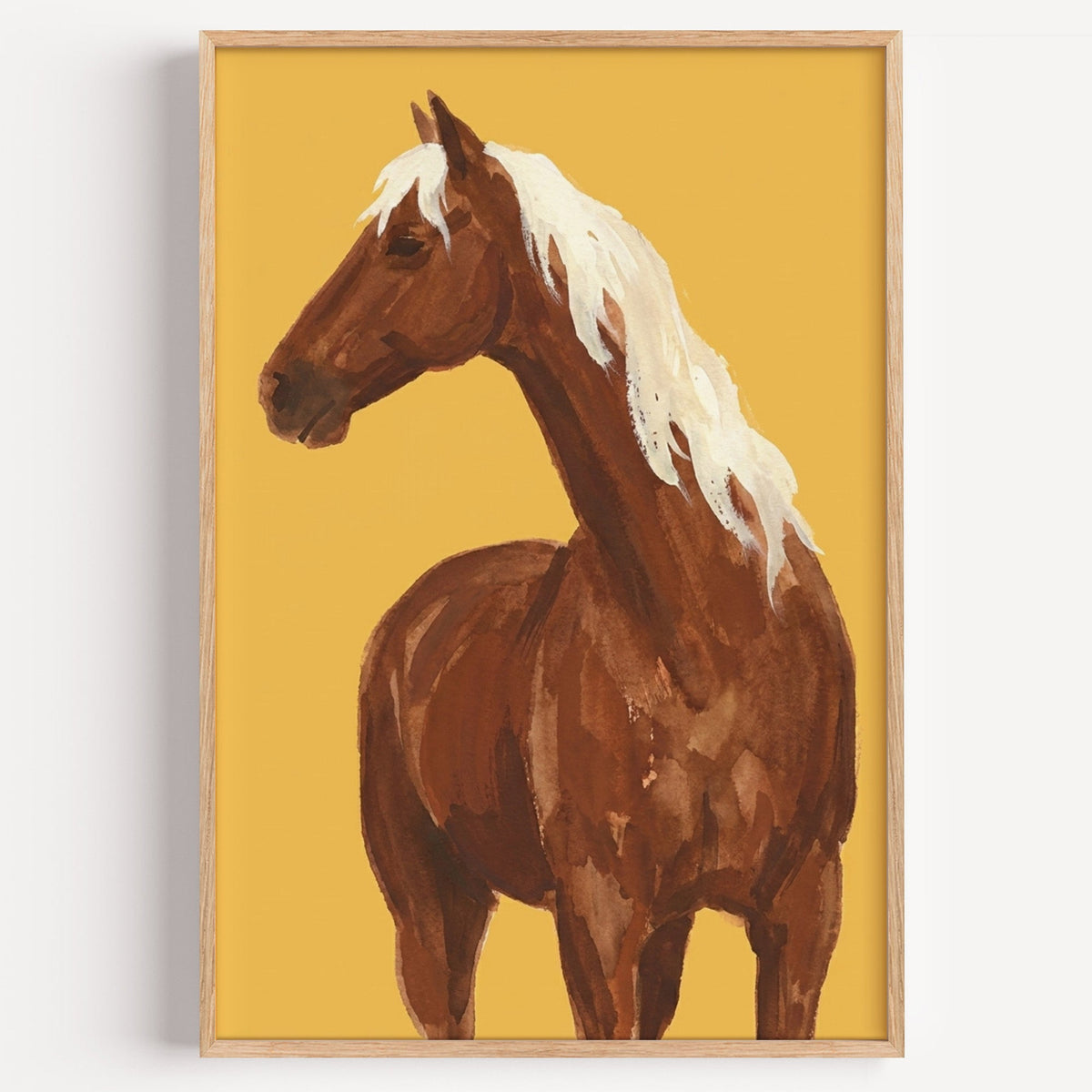 Chestnut horse watercolor print in a light oak frame on a plain white wall