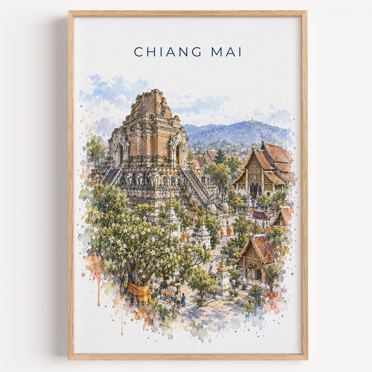 Chiang Mai watercolor print in a light oak frame on a plain white wall