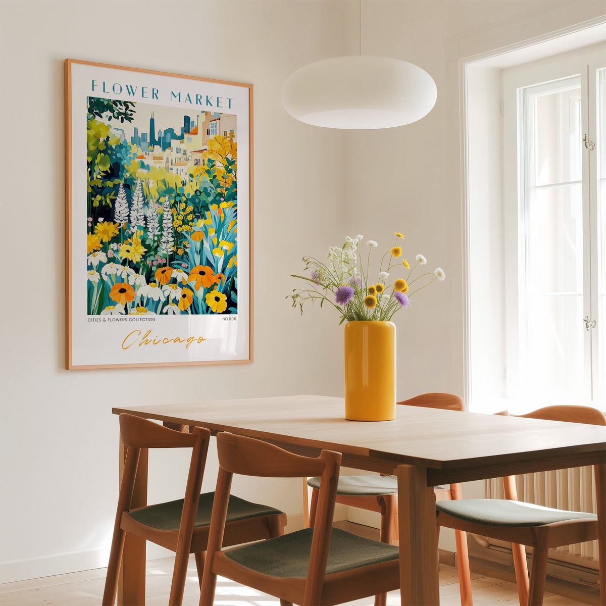 Chicago flower market print in an oak frame above a dining table with a yellow vase and white pendant light