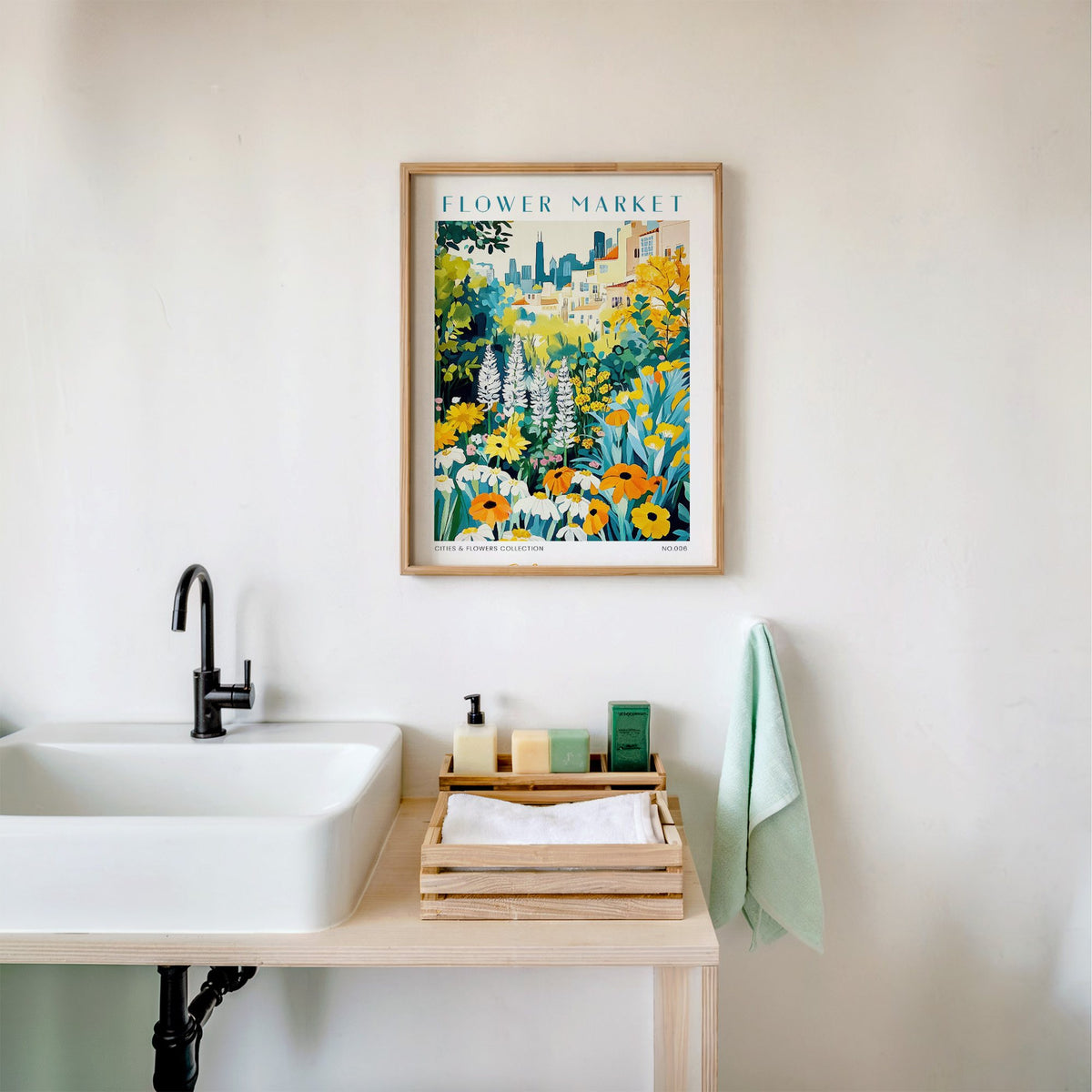 Chicago flower market print in an oak frame above a white bathroom sink with folded towels