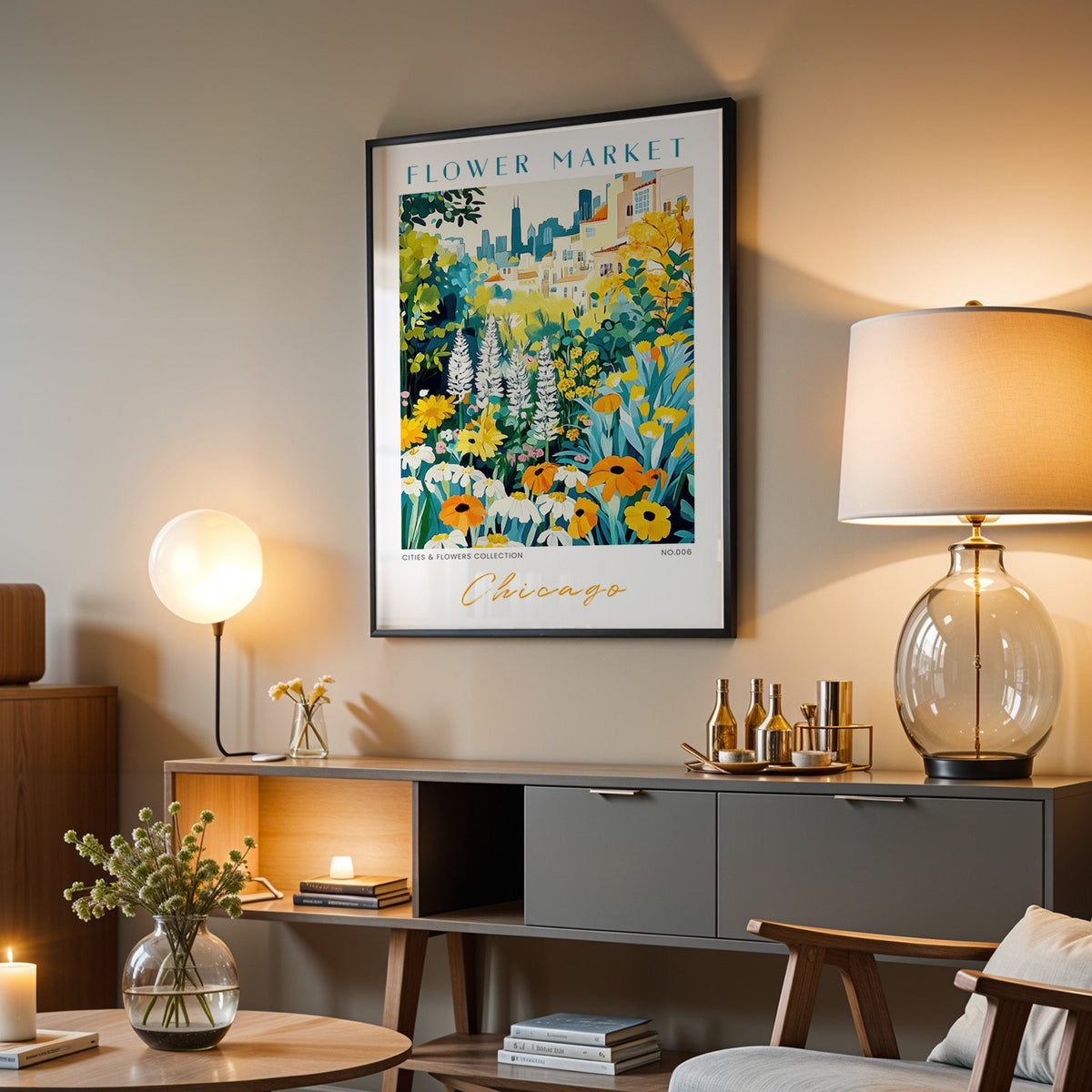 Chicago flower market print in a black frame above a grey media console with a glass table lamp