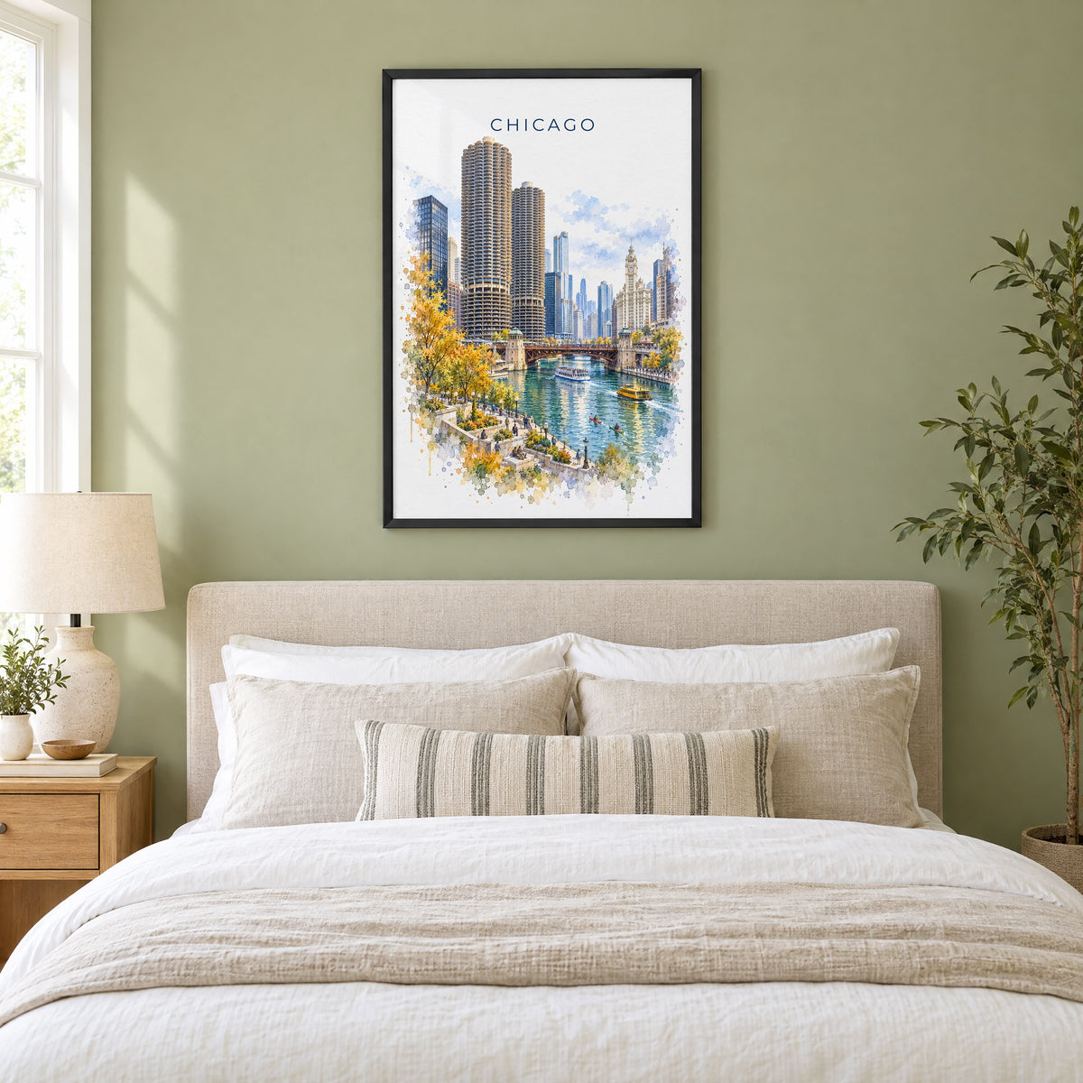 Chicago Riverwalk watercolor print in a black frame above an upholstered headboard in a sage green bedroom