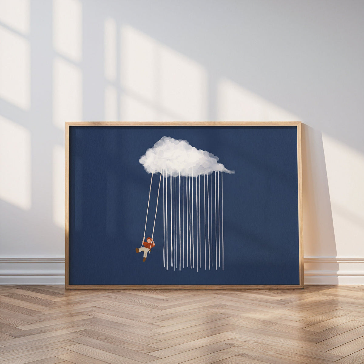 Surreal swing and rain print in an oak frame leaning on a parquet floor in window light