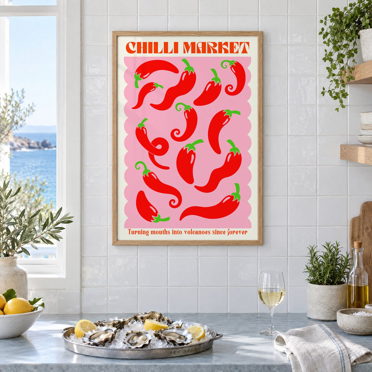 CHILLI MARKET red peppers pink scallop print in an oak frame on white tiles above a marble counter with oysters and lemons by a sea view