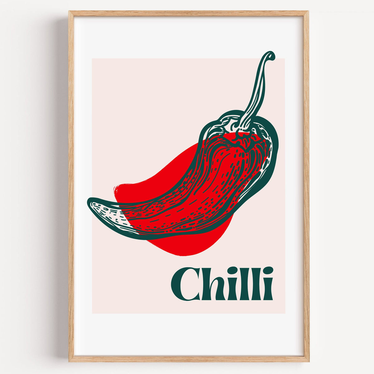 Chilli red pepper sketch print in a light oak frame on a plain white wall