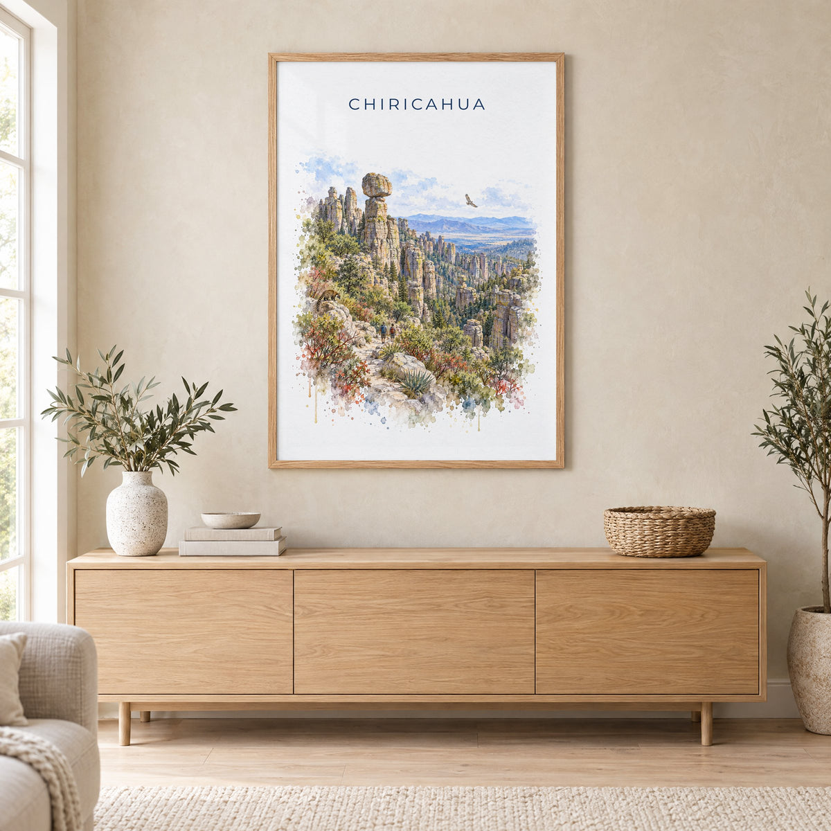 Chiricahua National Park watercolor print in an oak frame above a light wood sideboard in a Scandinavian living room