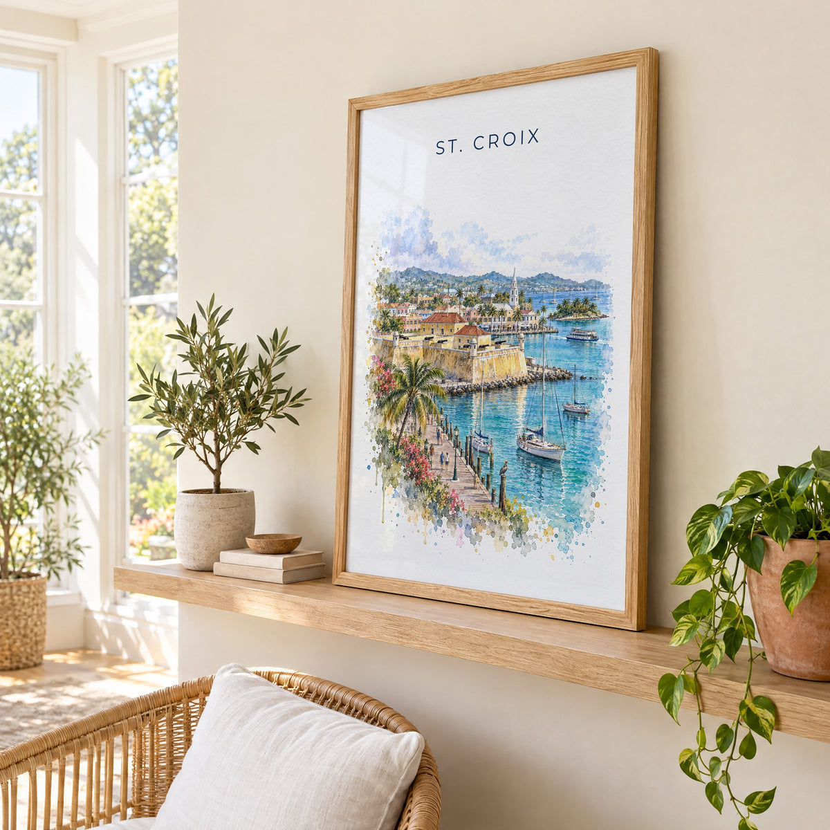 St. Croix watercolor print in an oak frame on a picture ledge in a sunlit sunroom