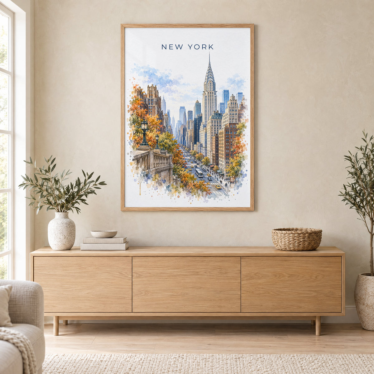 Chrysler Building watercolor print in an oak frame above a light wood sideboard in a Scandinavian living room