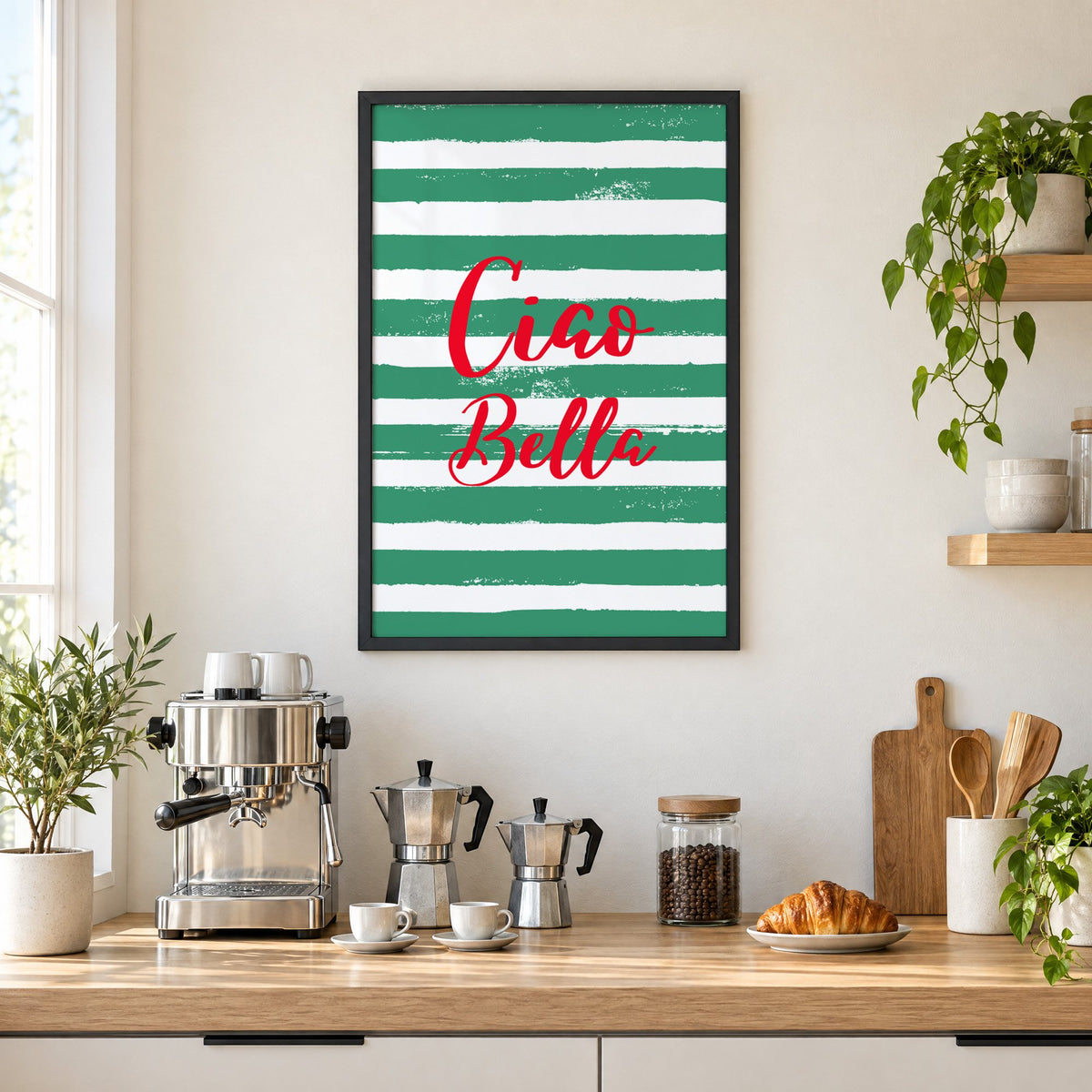 Ciao Bella red script on green stripes print in a black frame above a home espresso bar with moka pots and espresso cups