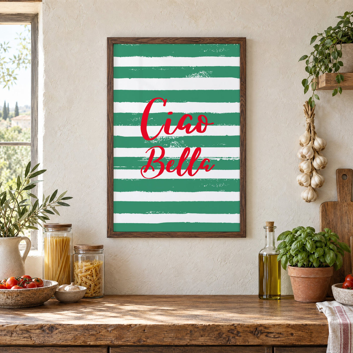 Ciao Bella red script on green stripes print in a walnut frame above a rustic Italian pantry counter with pasta jars, garlic and tomatoes