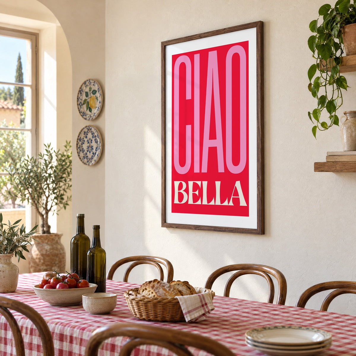 Ciao Bella pink and red type print in a walnut frame above a gingham-covered trattoria table, seen at an angle