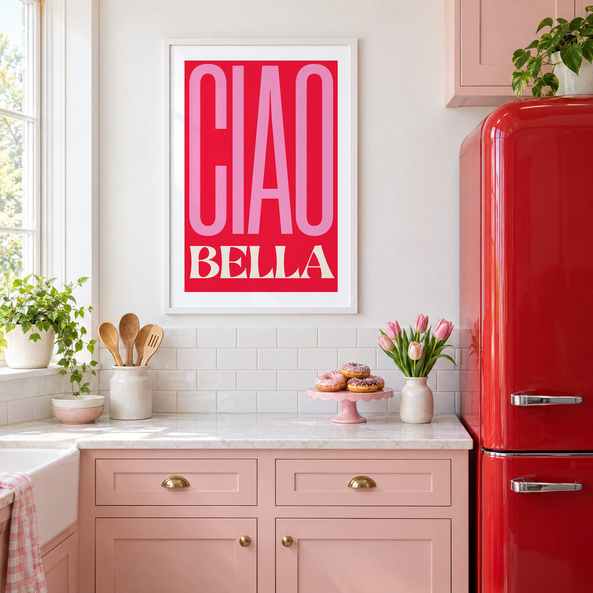 Ciao Bella pink and red type print in a white frame in a pink kitchen beside a red retro fridge