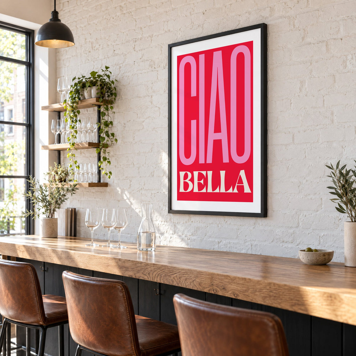 Ciao Bella pink and red type print in a black frame on a white brick wall above a wine bar counter