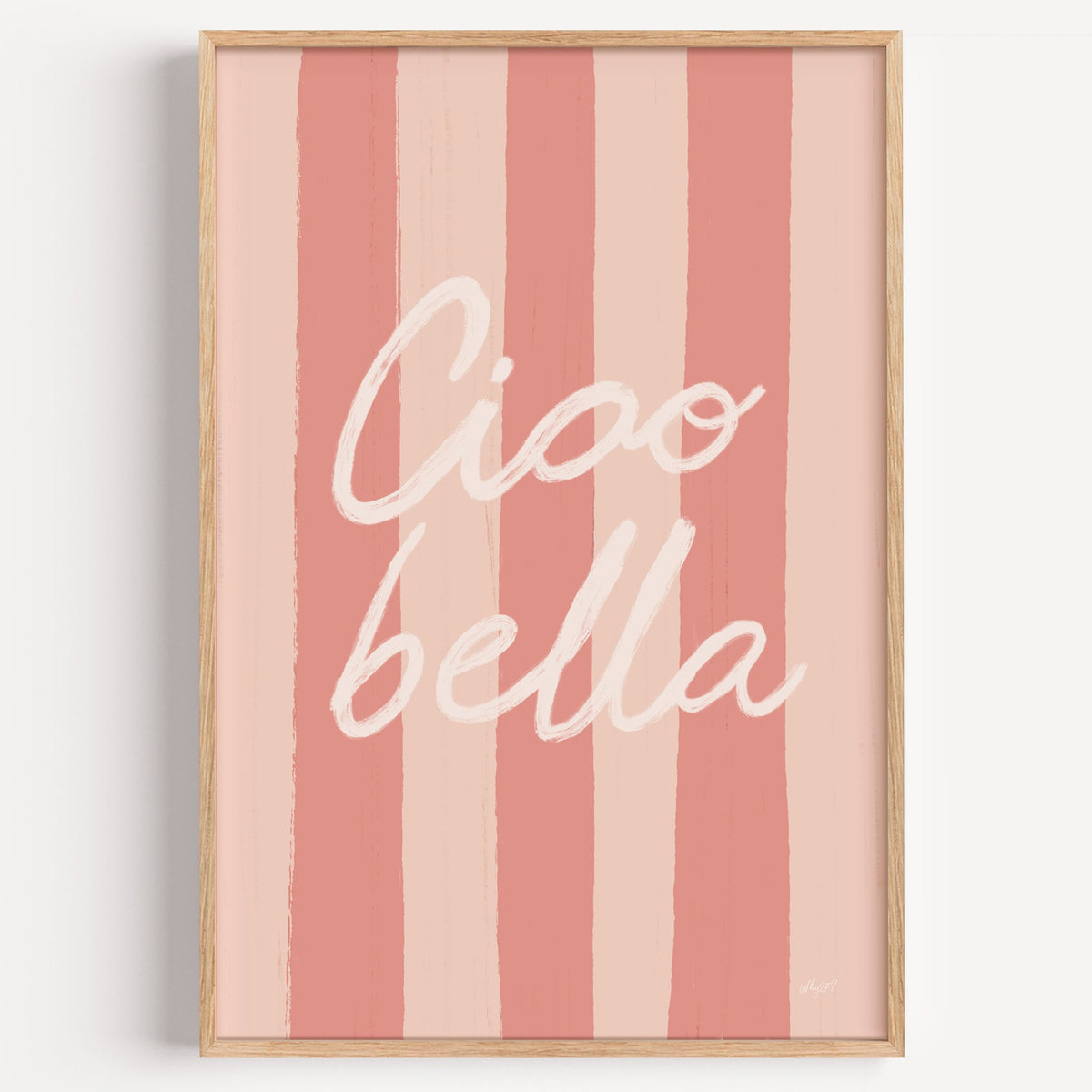 Ciao bella script on pink stripes nursery print in a light oak frame on a plain white wall