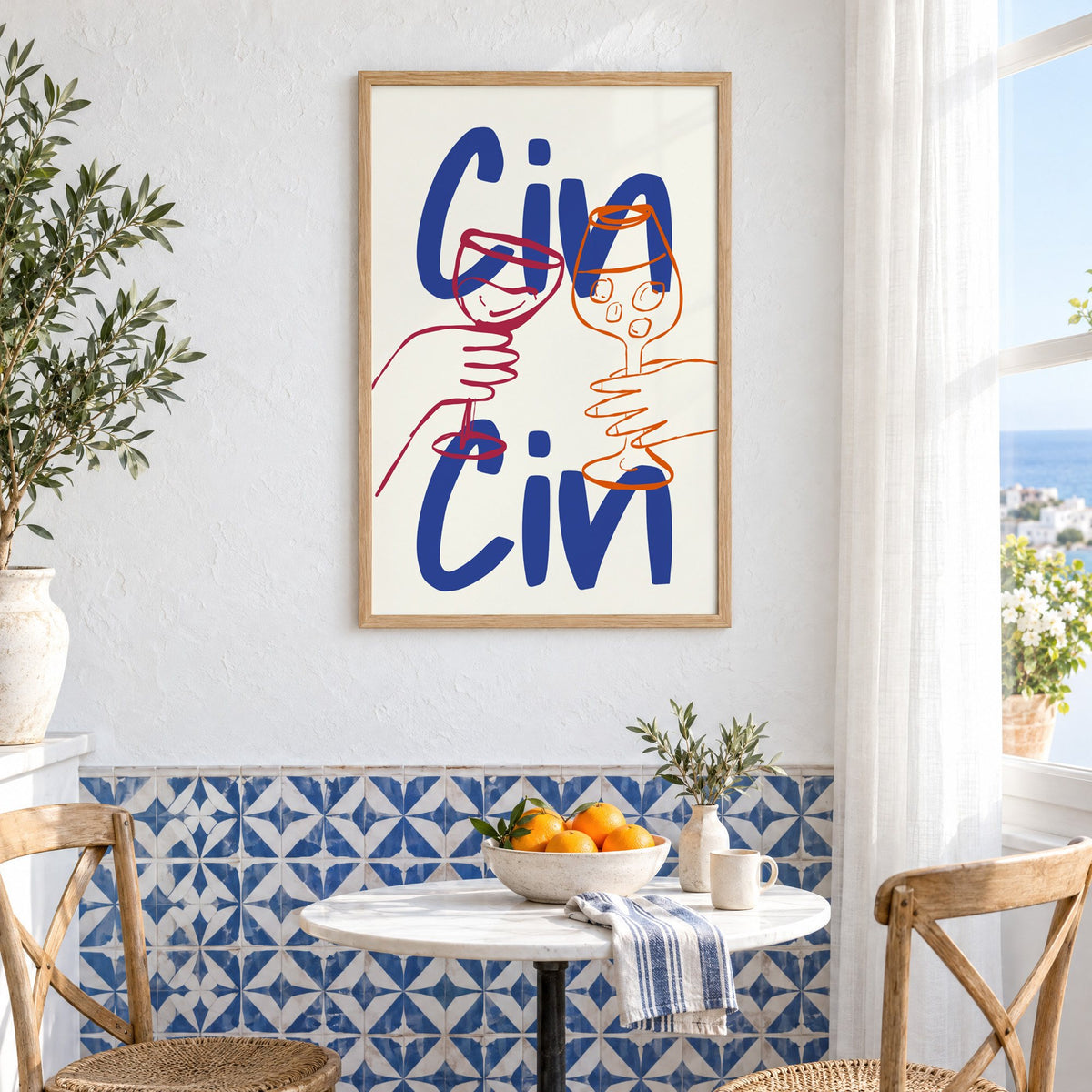 Cin Cin cobalt blue toast print in an oak frame above a bistro table and blue patterned tiles