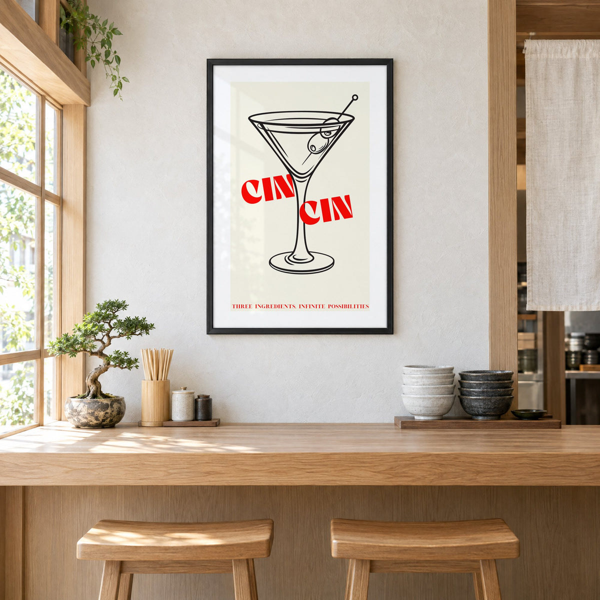 CIN CIN red type martini olives print in a black frame above a light wood ramen counter with stools and stacked bowls