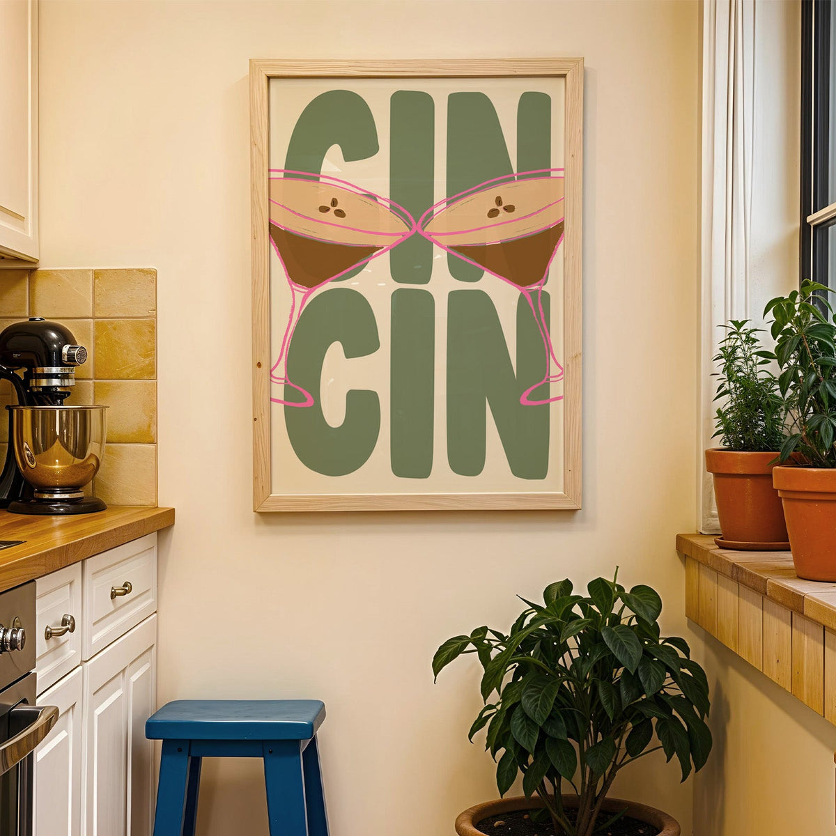 Cin cin espresso martini print in a wood frame on a yellow tiled kitchen wall