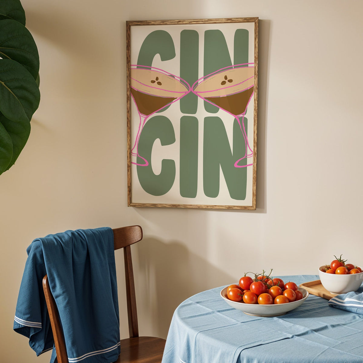 Cin cin espresso martini print in an oak frame above a blue linen table