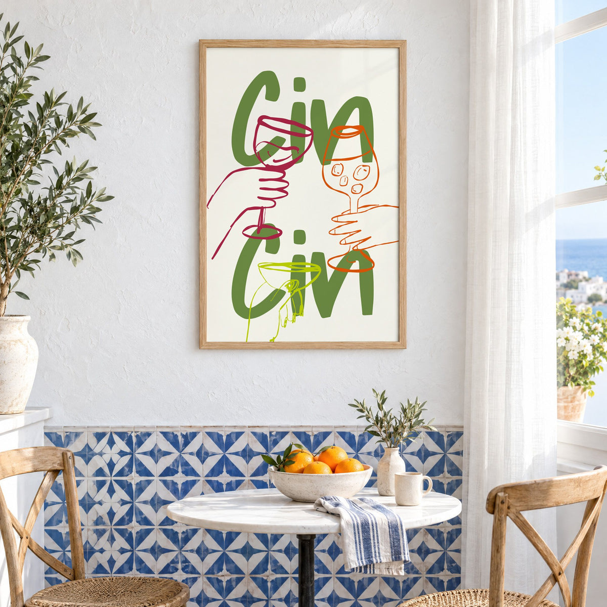 Cin Cin olive green three glasses print in an oak frame above a bistro table and blue patterned tiles