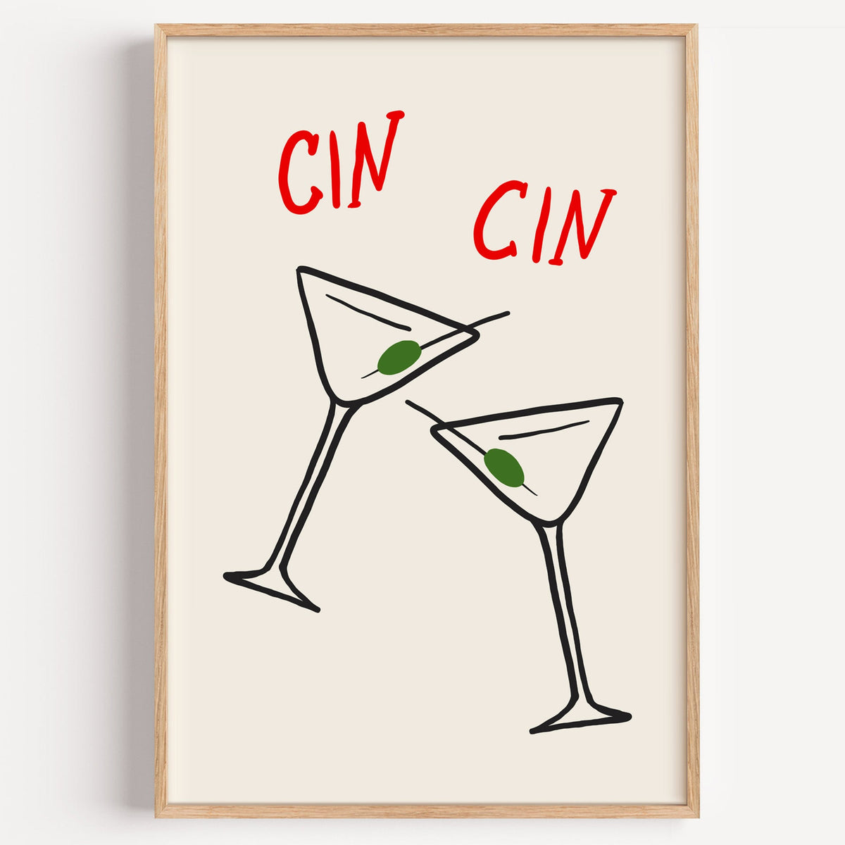 Cin cin olive martini print in a light oak frame on a plain white wall