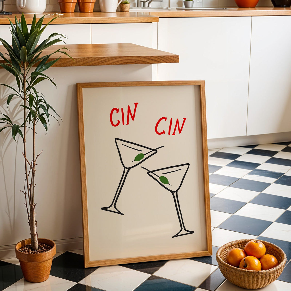 Cin cin olive martini print in an oak frame by a kitchen island and tiled floor