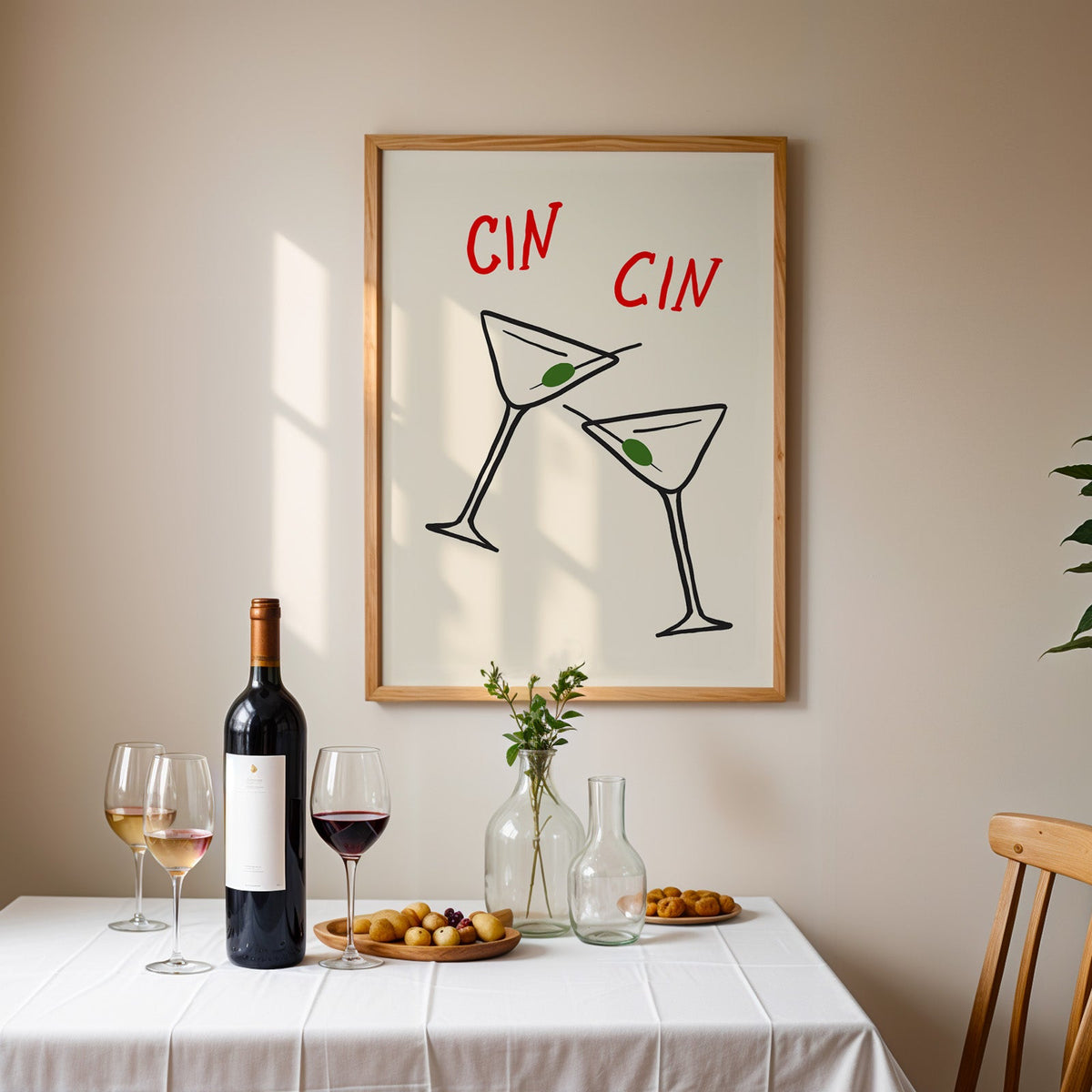 Cin cin olive martini print in an oak frame above a table laid with wine