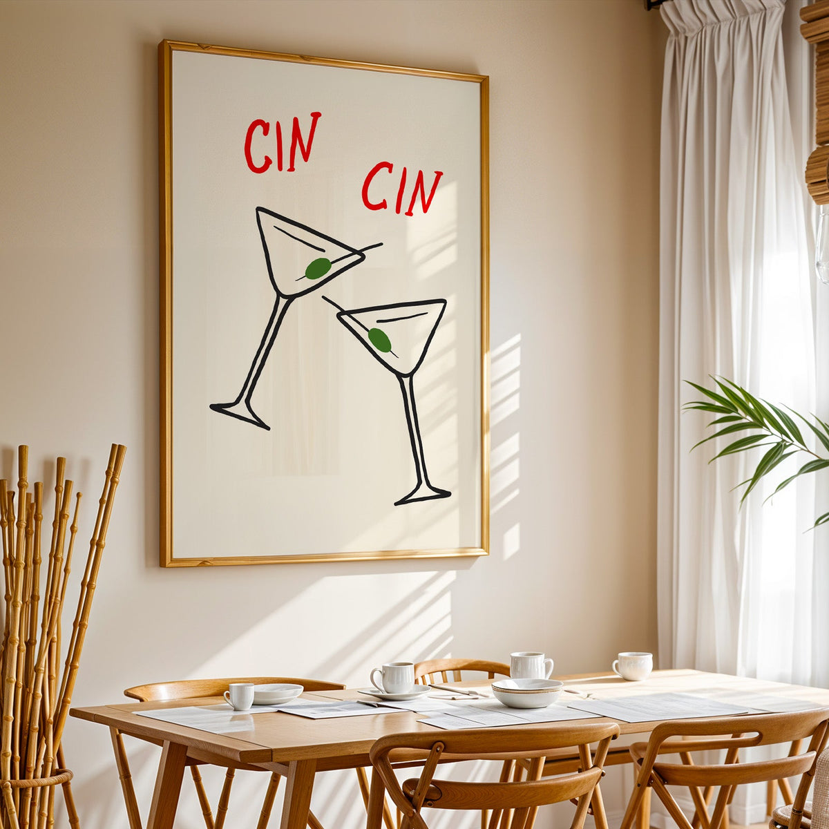 Cin cin olive martini print in a gold frame above a sunlit breakfast table