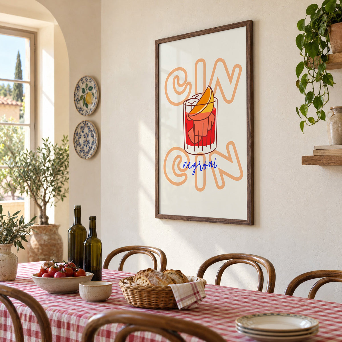 Cin Cin negroni orange slice print in a walnut frame above a gingham-covered trattoria table, seen at an angle