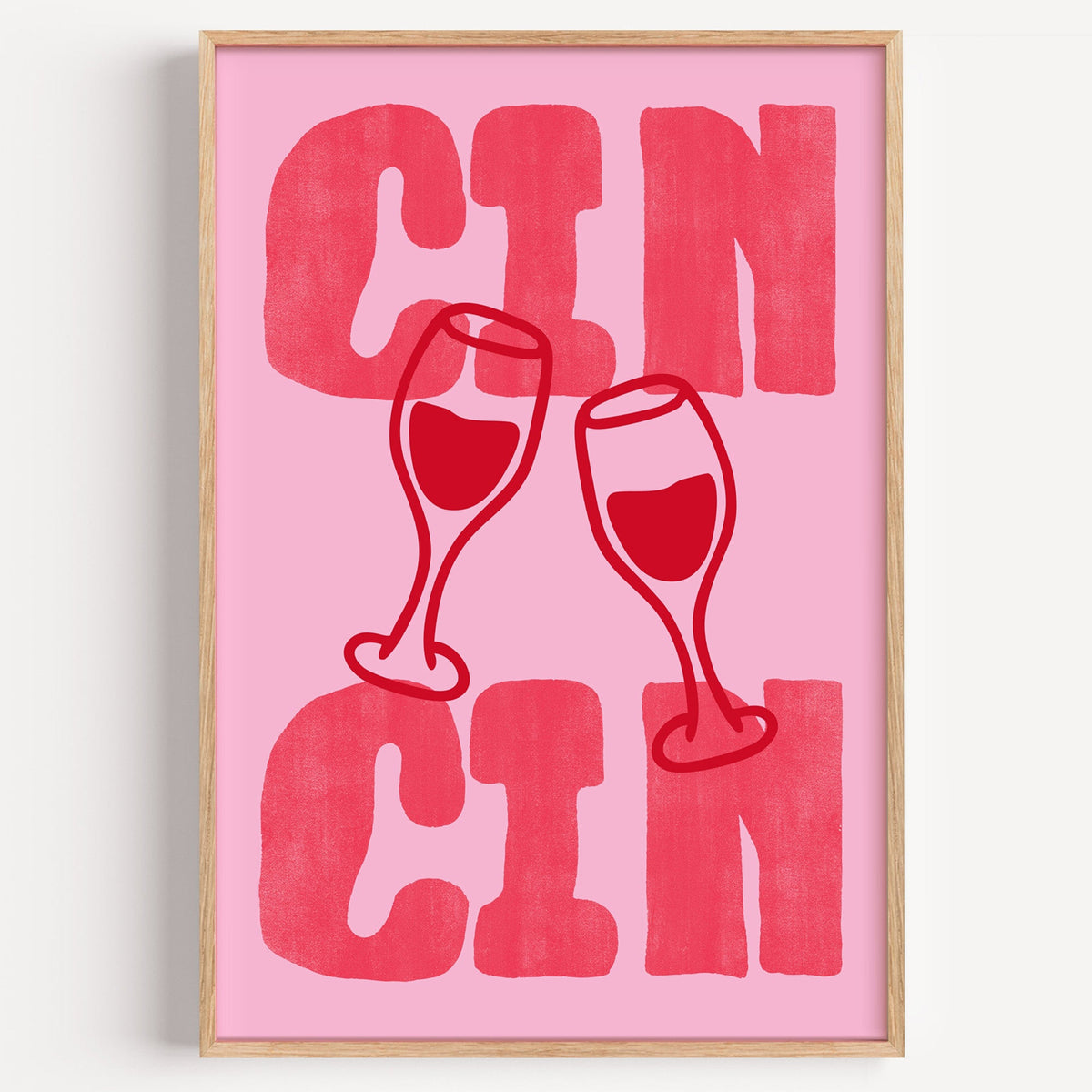 Cin Cin bold red type print in a light oak frame on a plain white wall