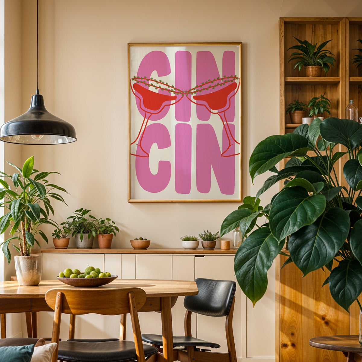 Cin cin pink coupe print in an oak frame above a dining room sideboard