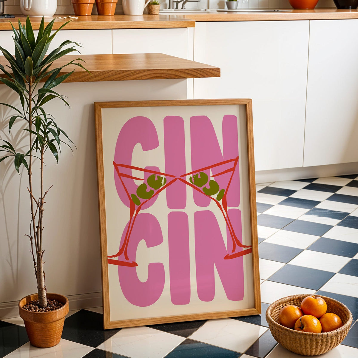 Cin cin red martini print in an oak frame by a kitchen island and checkered floor