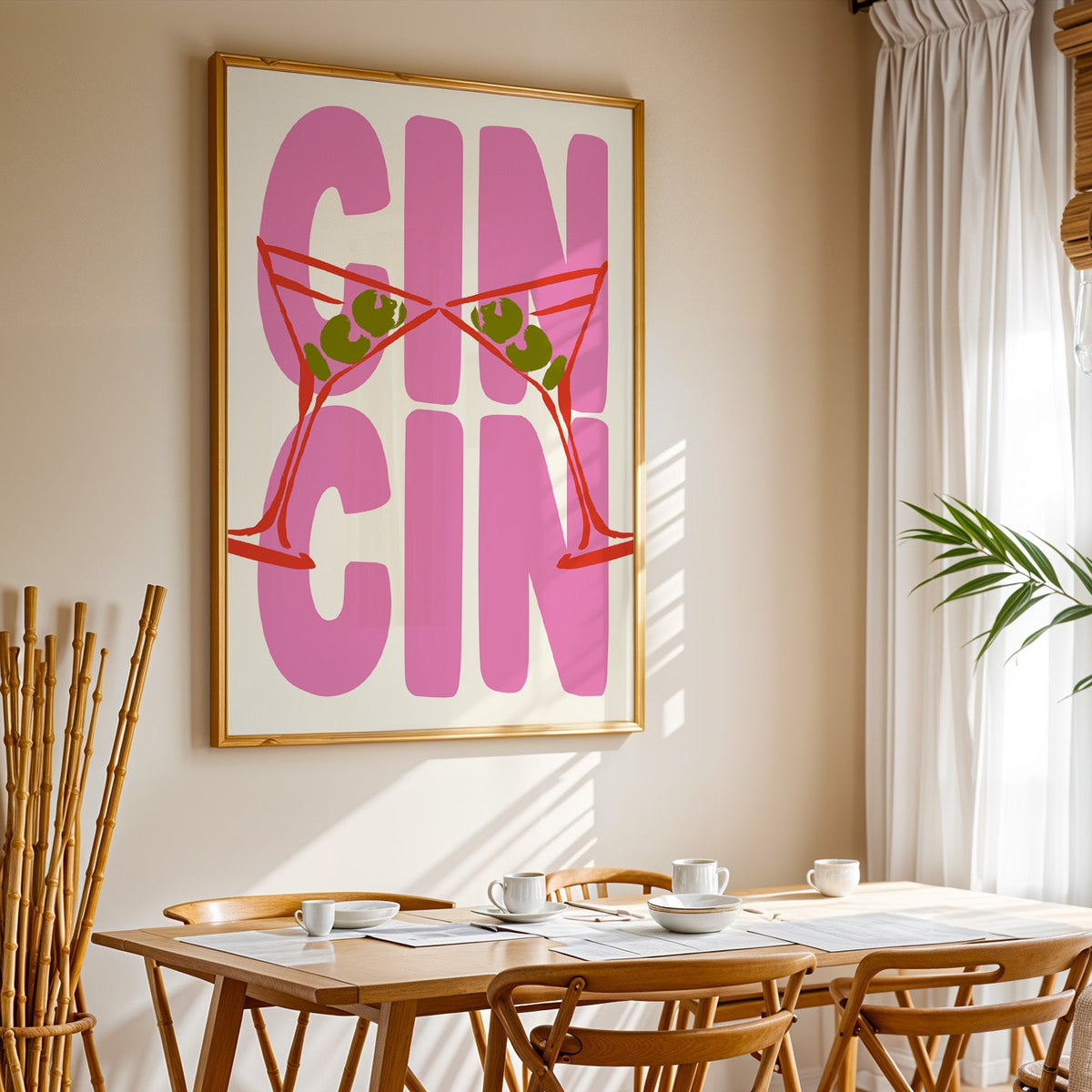 Cin cin red martini print in a gold frame above a sunlit breakfast table