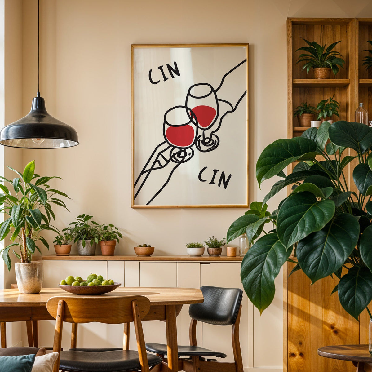 Cin cin red wine line art print in an oak frame above a sideboard in a plant-filled dining room