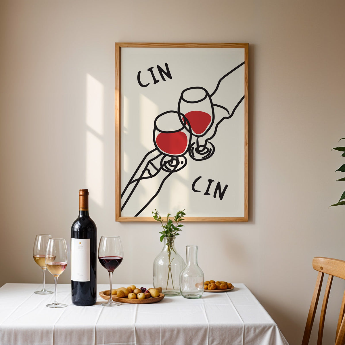 Cin cin red wine line art print in an oak frame above a table laid with red wine and glasses