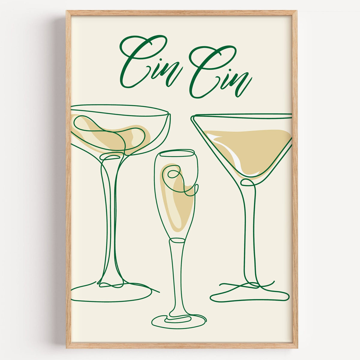 Cin Cin one-line coupe, flute and martini print in a light oak frame on a plain white wall