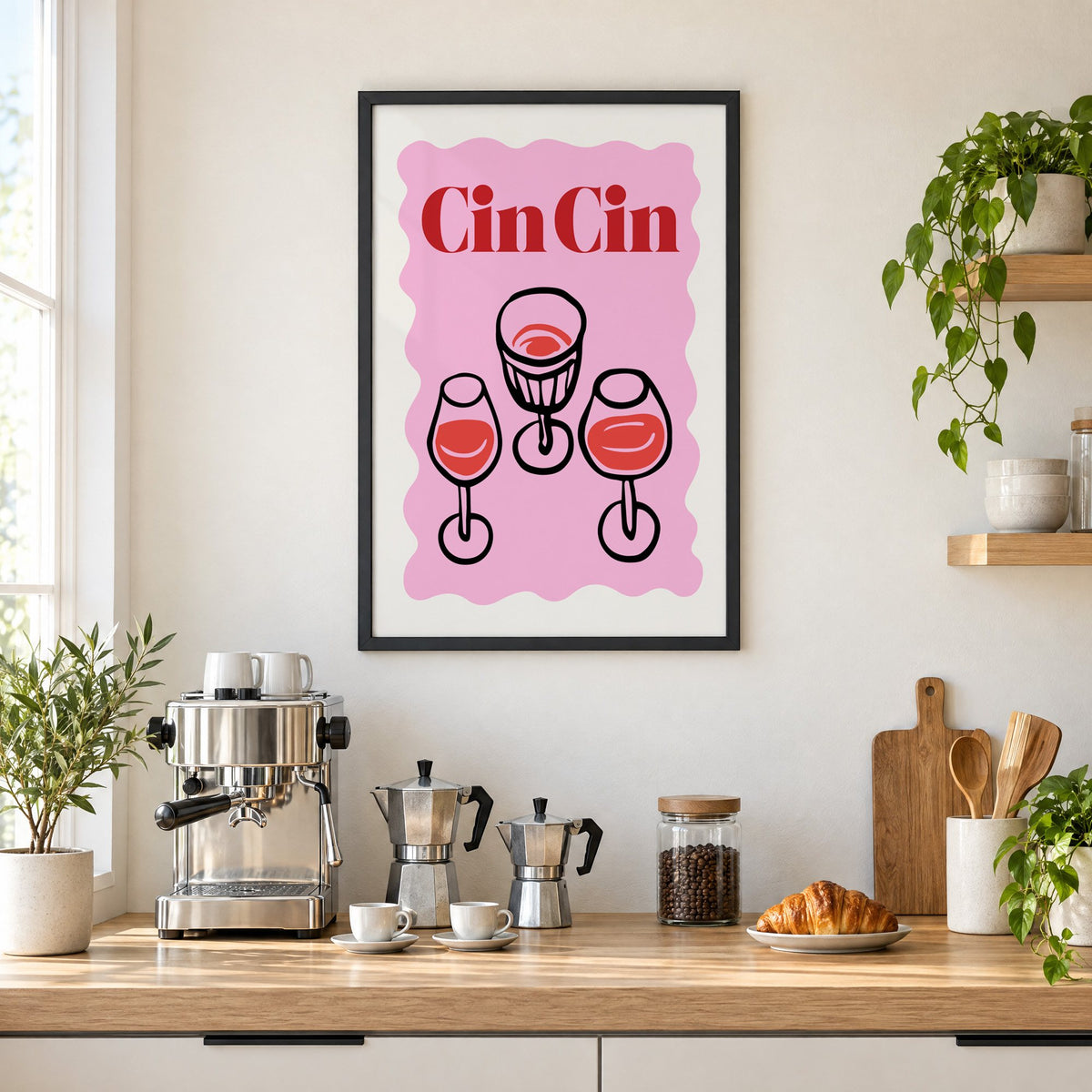 Cin Cin three glasses top view print in a black frame above a home espresso bar with moka pots and espresso cups