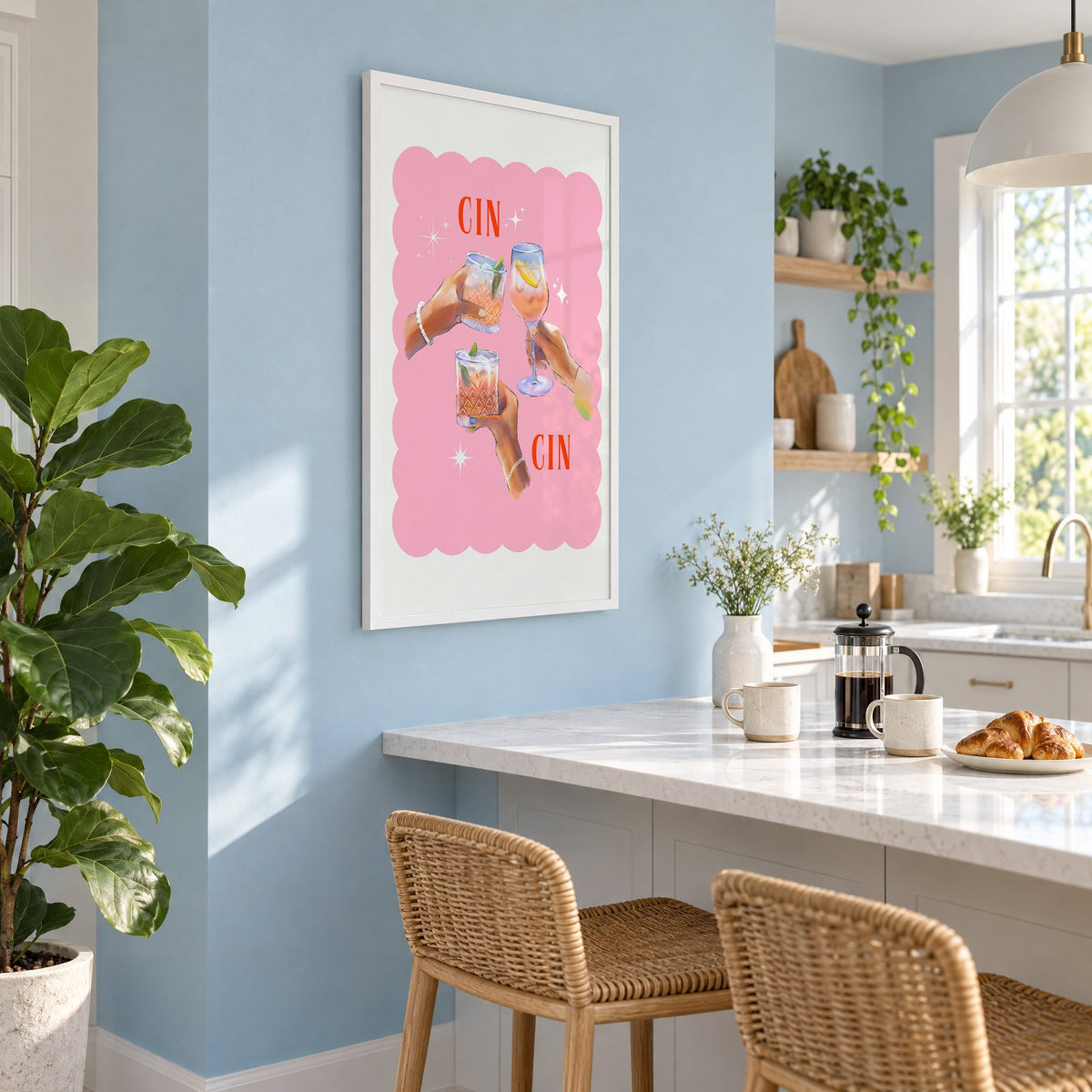 Cin Cin three hands toasting print in a white frame on a pale blue wall above a breakfast bar with rattan stools