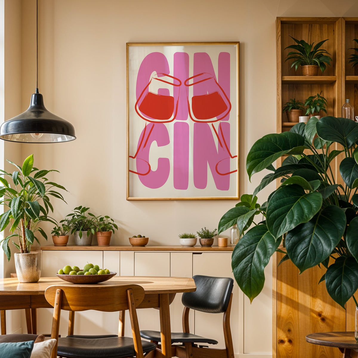 Cin cin wine glasses print in an oak frame above a sideboard in a plant-filled dining room