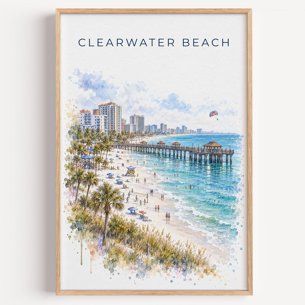 Clearwater Beach watercolor print in a light oak frame on a plain white wall
