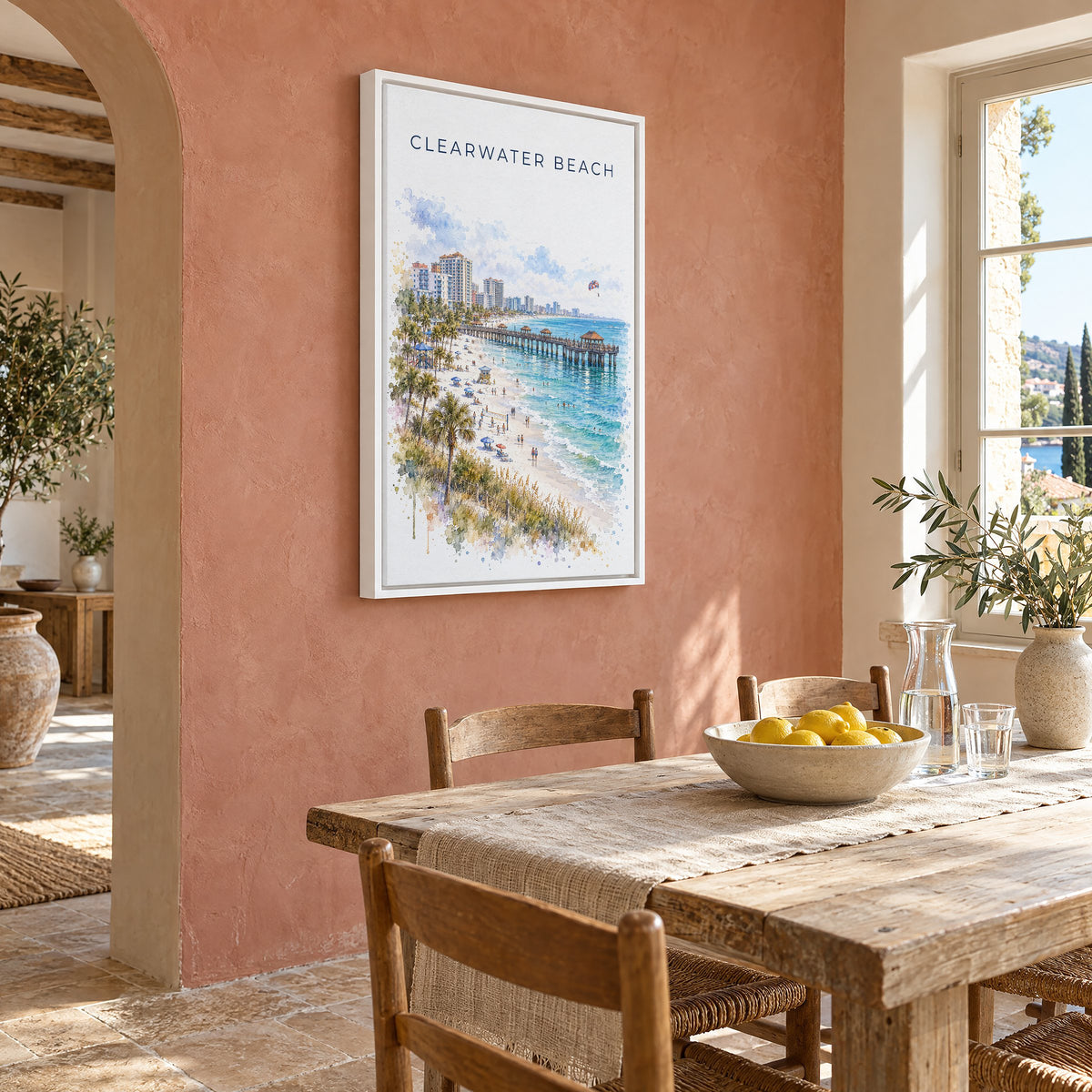 Clearwater Beach watercolor print as a white floater canvas on a terracotta wall above a rustic dining table