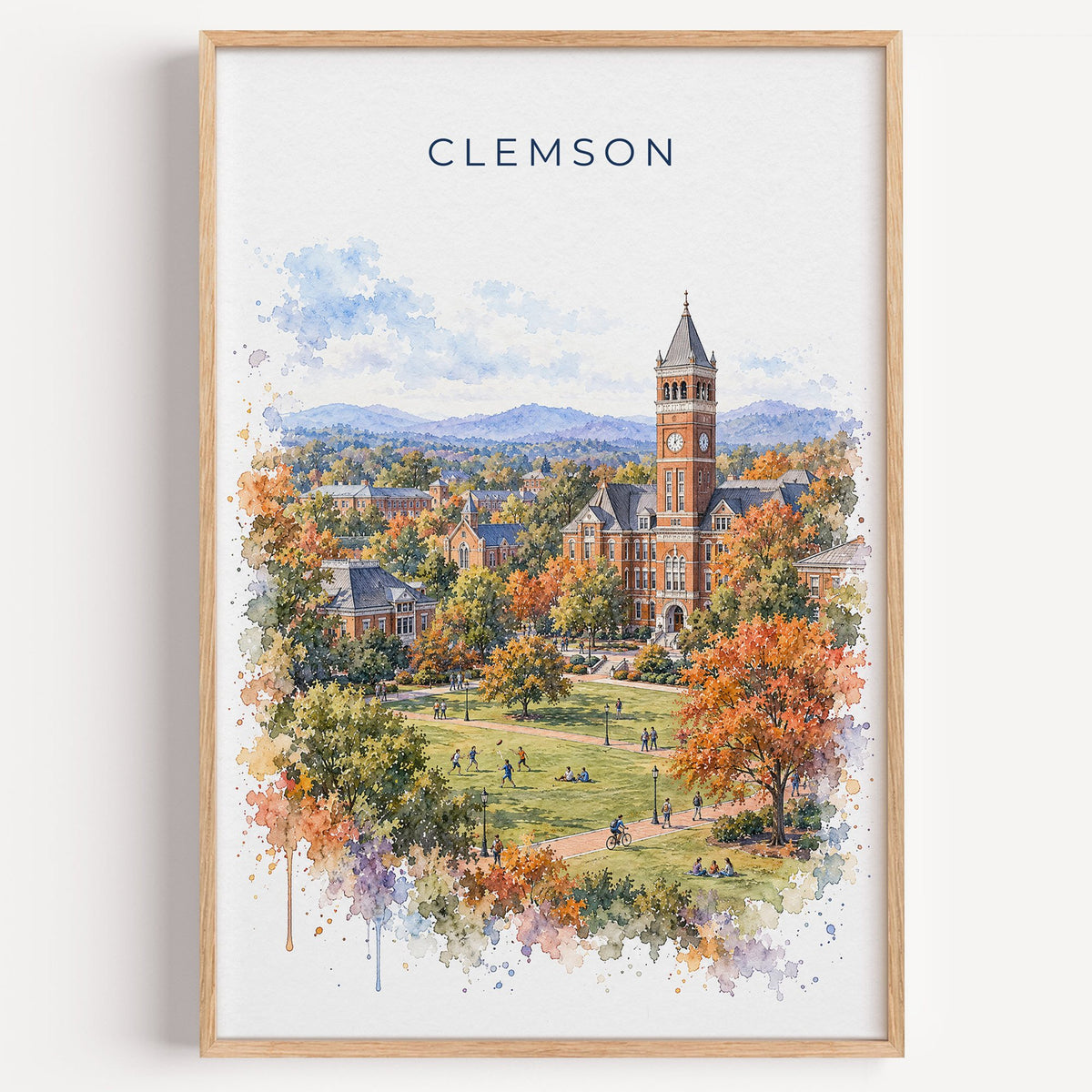 Clemson watercolor print in a light oak frame on a plain white wall