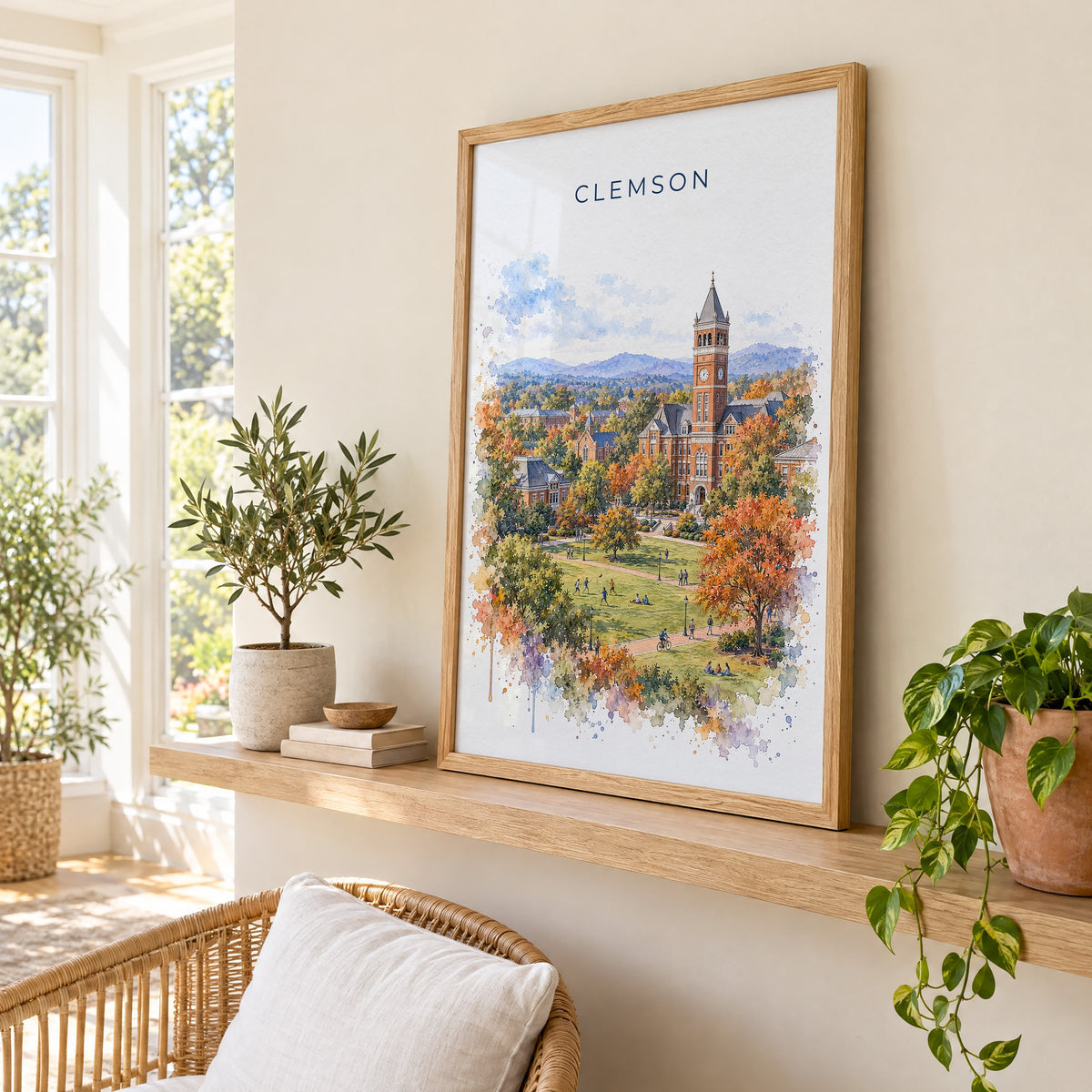 Clemson watercolor print in an oak frame on a picture ledge in a sunlit sunroom