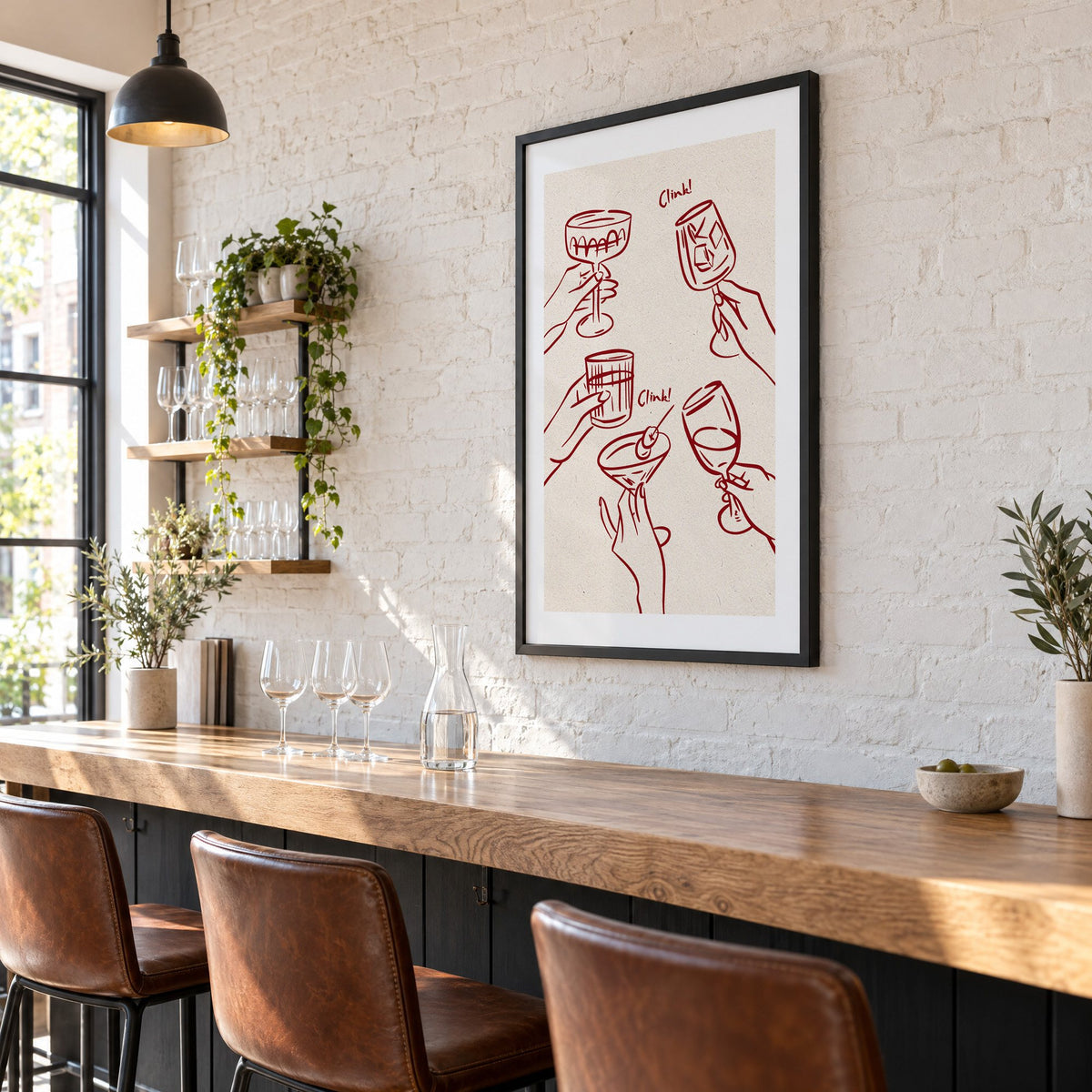 Clink! wine-red cocktail toast print in a black frame on a white brick wall above a wine bar counter