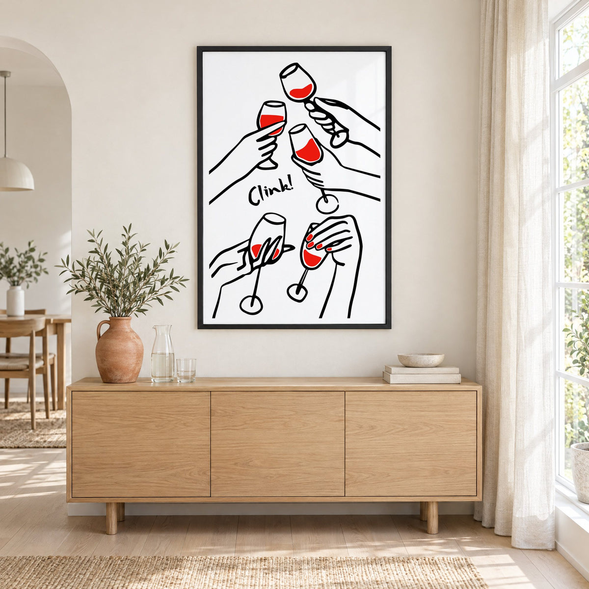 Clink five hands red wine toast print in a black frame above an oak sideboard with a terracotta vase of olive branches