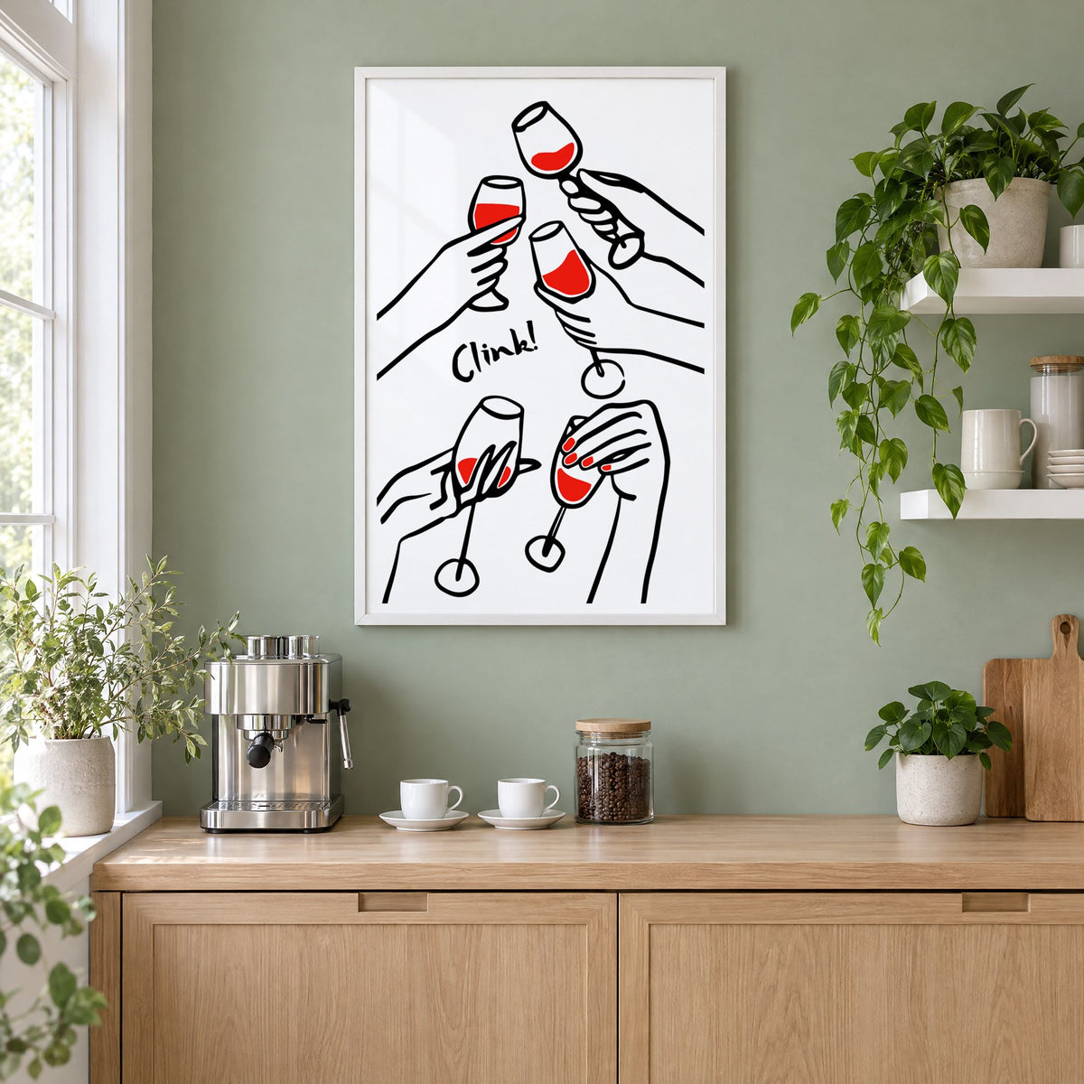 Clink five hands red wine toast print in a white frame on a sage green coffee nook wall above an espresso machine