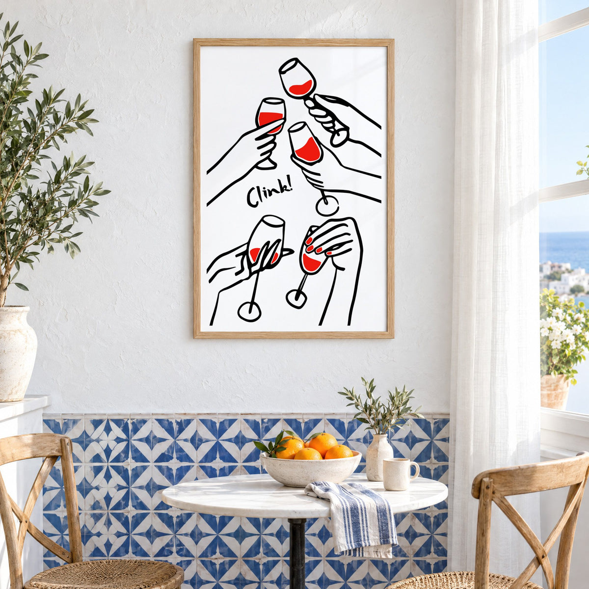 Clink five hands red wine toast print in an oak frame above a bistro table and blue patterned tiles