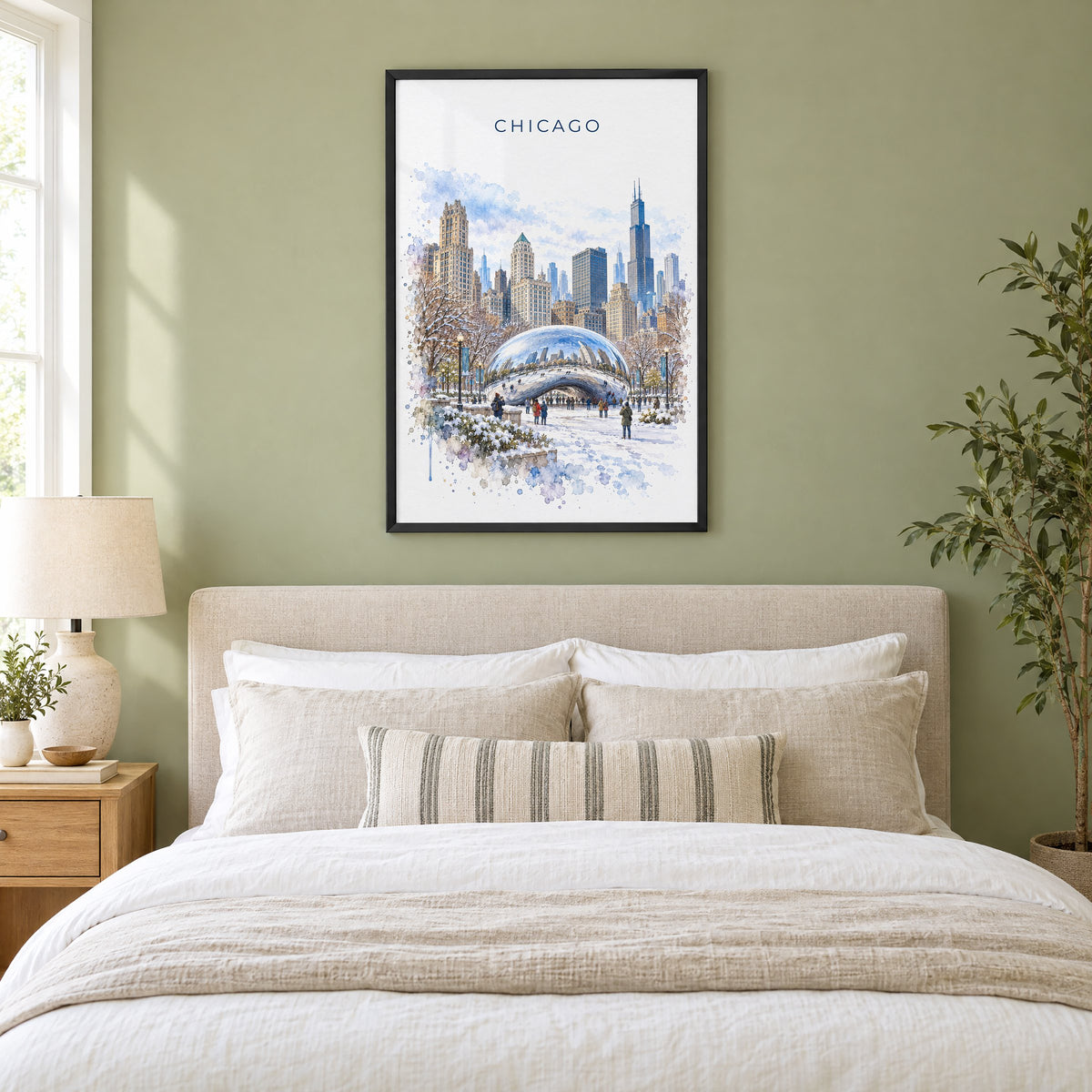 Cloud Gate watercolor print in a black frame above an upholstered headboard in a sage green bedroom