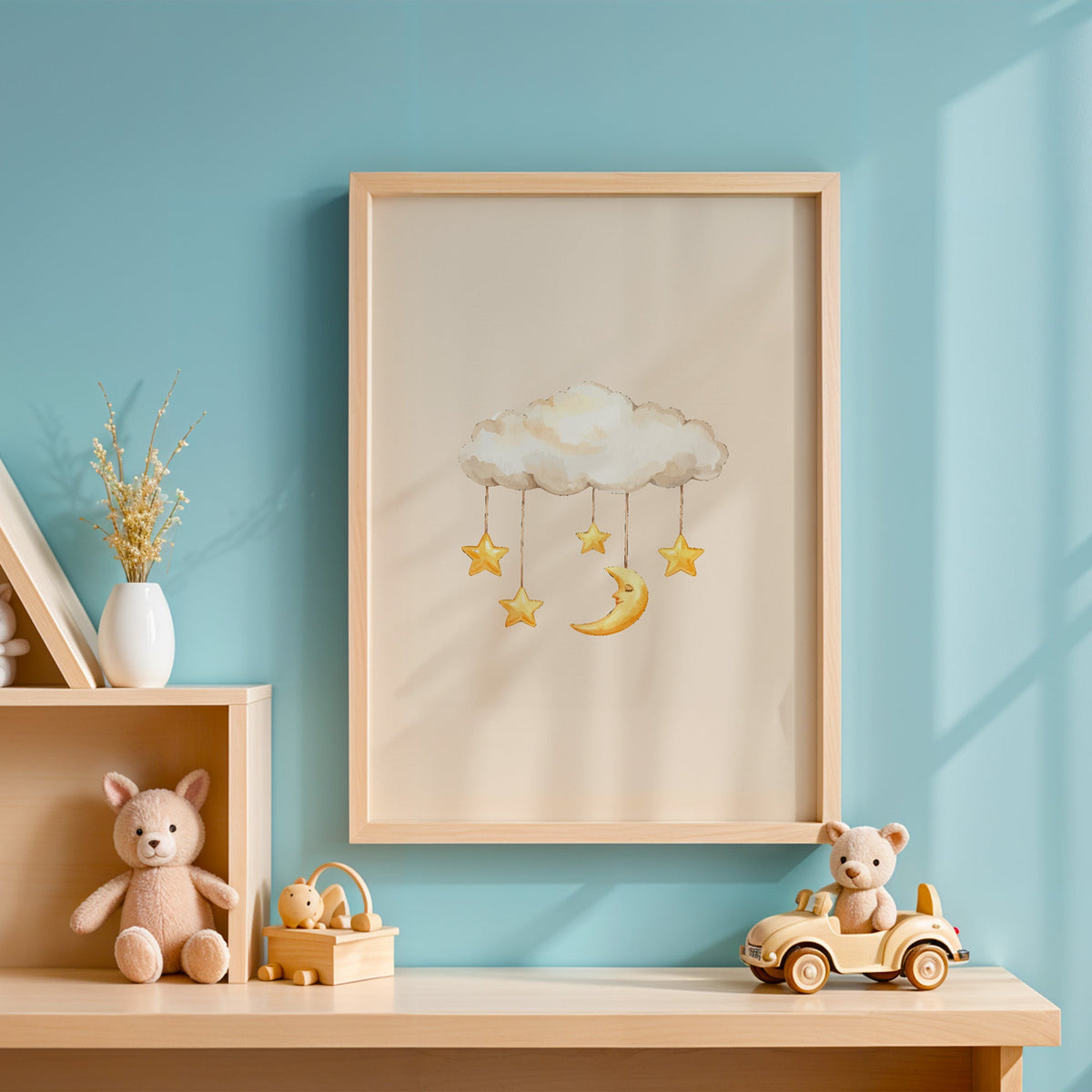 Cloud mobile with moon and stars nursery print in an oak frame on a blue wall above a shelf of wooden toys