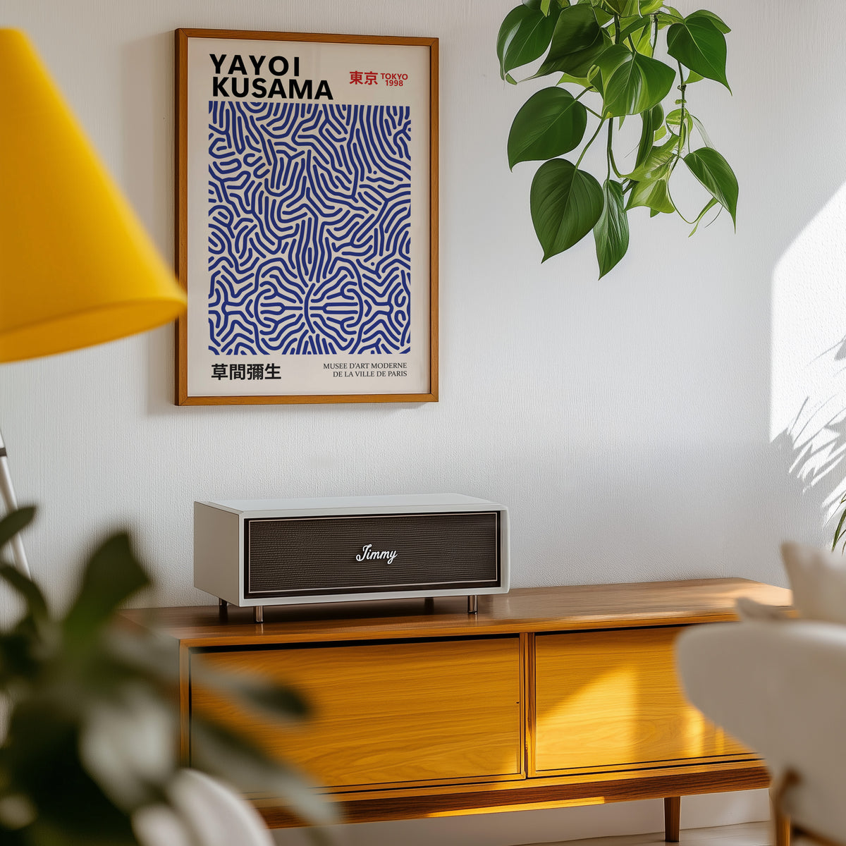Yayoi Kusama inspired cobalt blue wavy line print above a sideboard with a plant