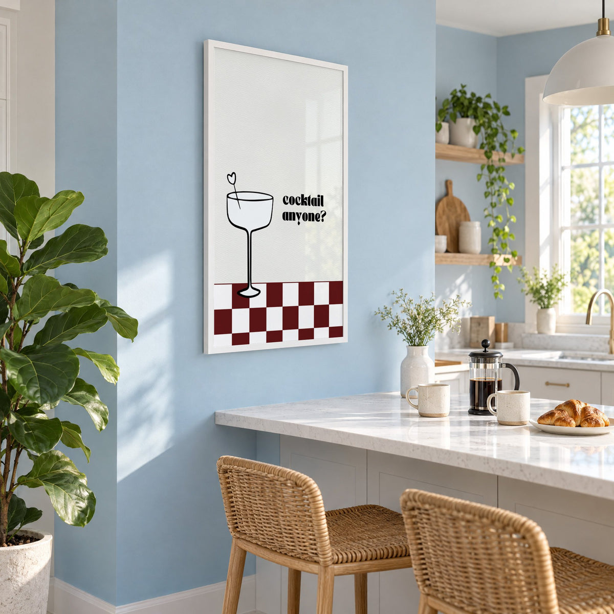 Cocktail anyone coupe check print in a white frame on a pale blue wall above a breakfast bar with rattan stools